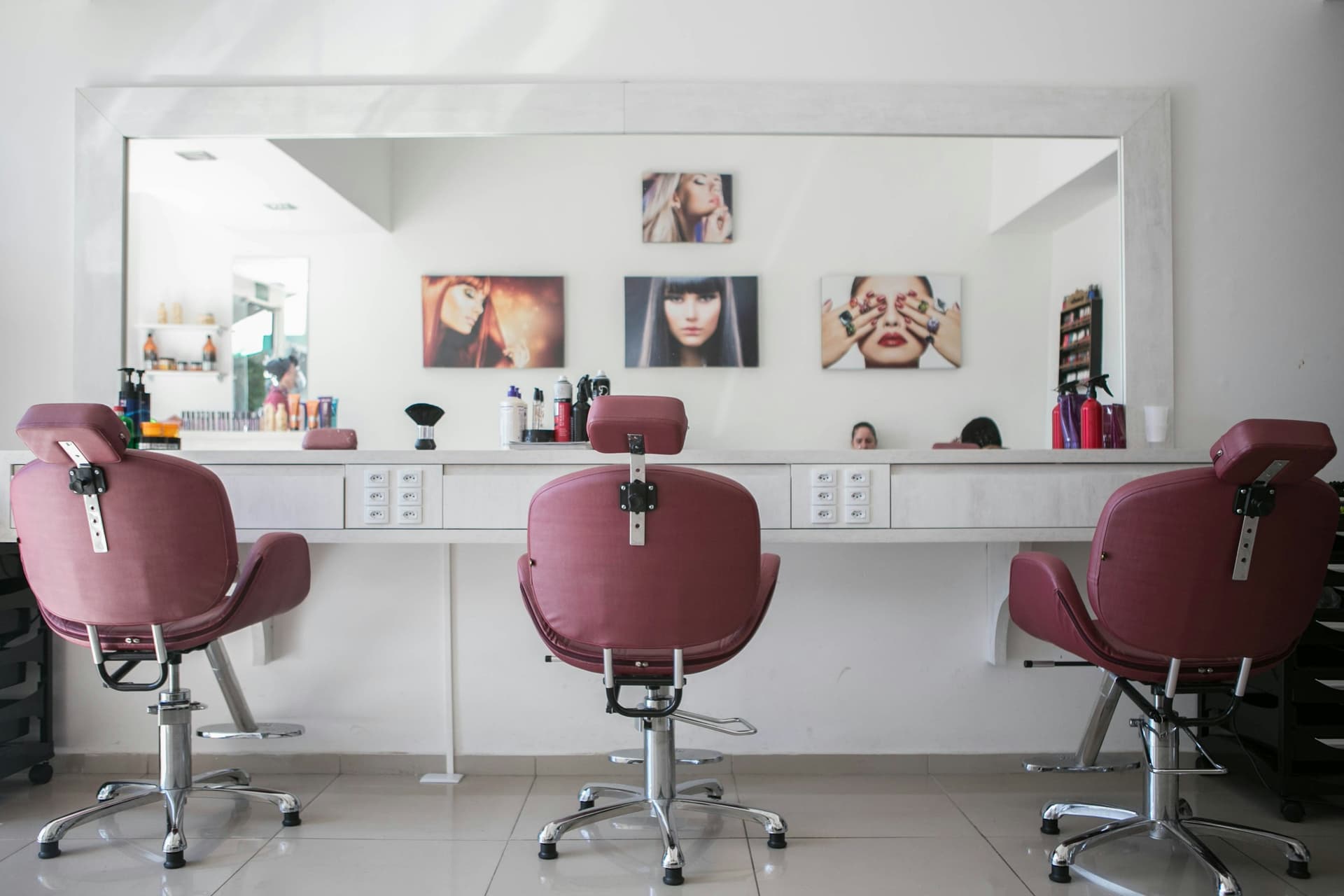 Barber shaping a fresh fade cut